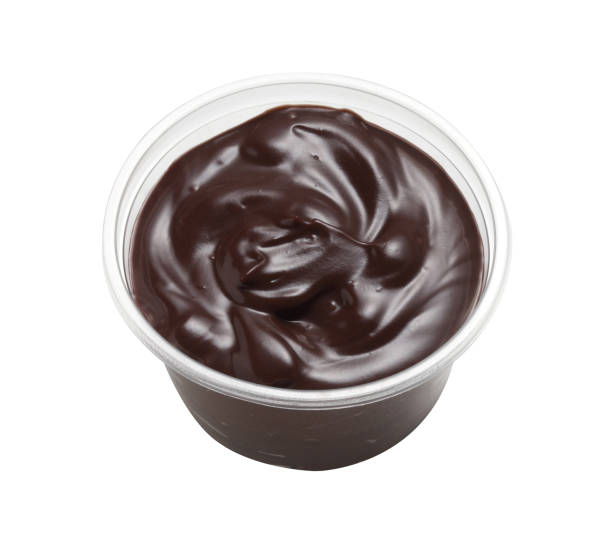 istock Chocolate cream in plastic cup isolated on white background 1356889525