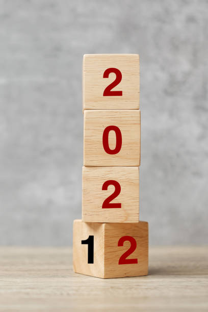 istock block flipping 2021 to 2022 text on table. Resolution, strategy, plan, goal, motivation, reboot, business and New Year holiday concepts 1356895651