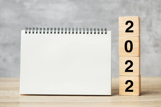 istock 2022 Happy New Year with blank notebook and wooden number. countdown, Resolution, Goals, Plan, Action and Mission Concept 1356896559