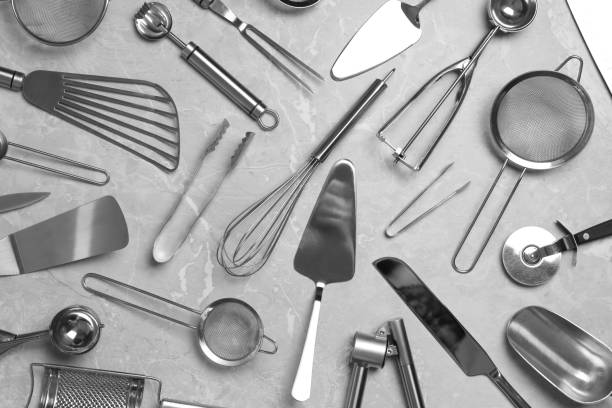 istock Cooking utensils on grey marble table, flat lay 1356899857