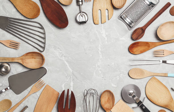 istock Frame of cooking utensils on grey marble table, flat lay. Space for text 1356902868
