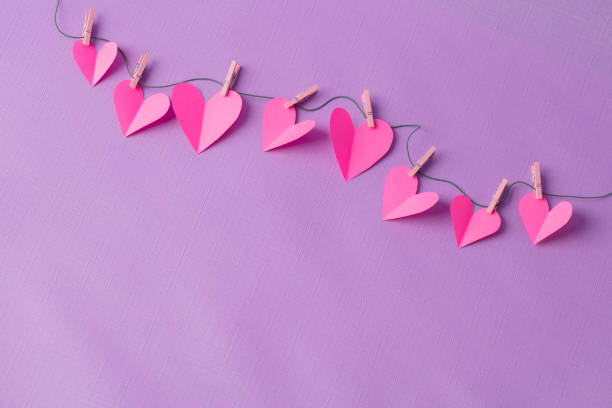 istock Paper hearts hanging on a clothesline with space for copy 1356908103