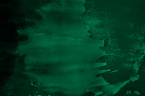 Acuarela abstracta verde. Pinceladas y manchas de pintura en la superficie del papel. photo
