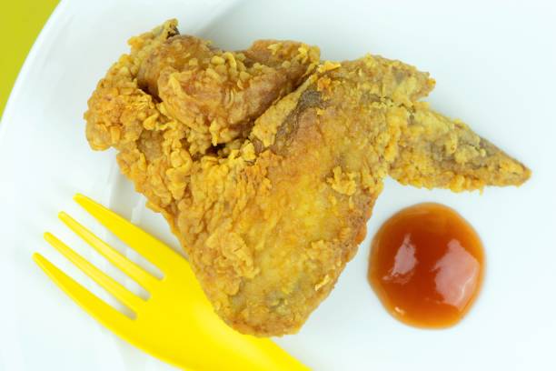 istock Fried Chicken wing and Ketchup on white plate. 1356908619