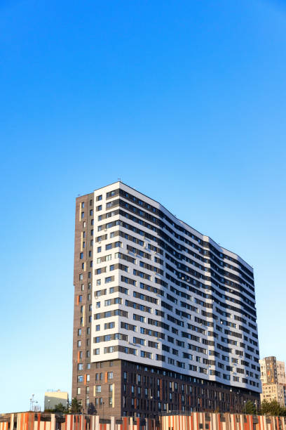 istock New modern residential apartment building on blue sky 1356908645