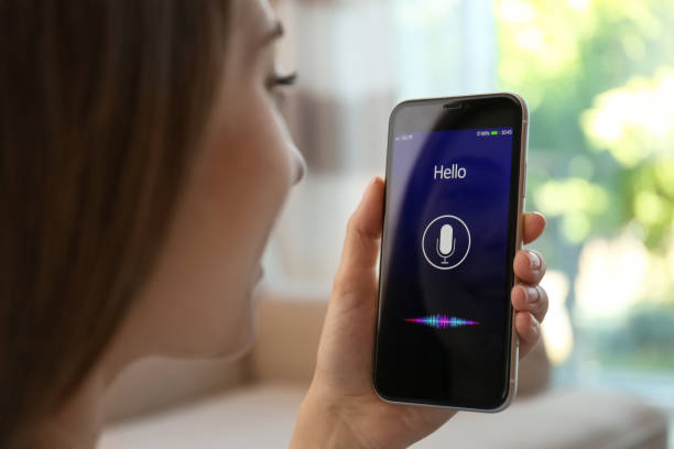 istock Woman using voice search on smartphone indoors, closeup 1356909286
