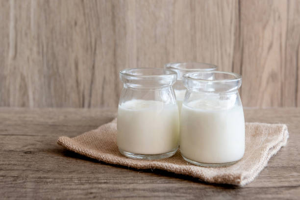 istock Yogurt in glass bottles 1356909747