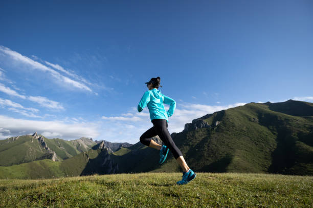istock Young woman ultramarathon runner running at mountain top 1356912833