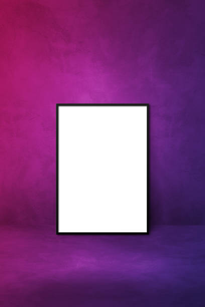 istock Black picture frame leaning on a purple wall 1356917368