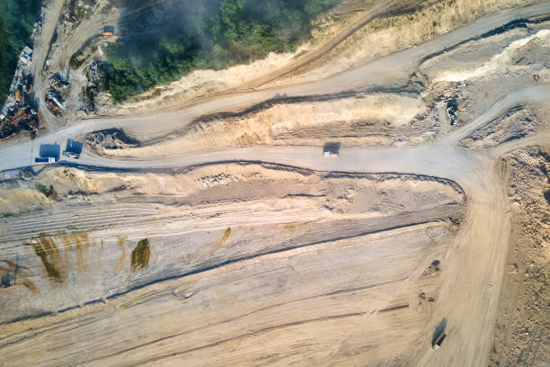 istock Aerial view of open pit mining site of limestone materials extraction for construction industry with excavators and dump trucks. 1356918752