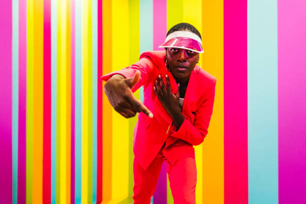istock Beautiful young woman dancing and having fun inside a rainbow box room 1356919726