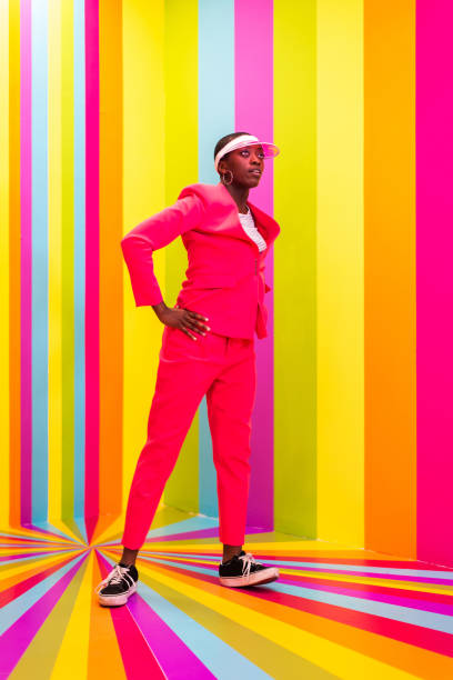 istock Beautiful young woman dancing and having fun inside a rainbow box room 1356919763