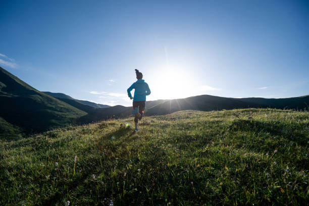 istock Young woman ultramarathon runner running at mountain top 1356920044