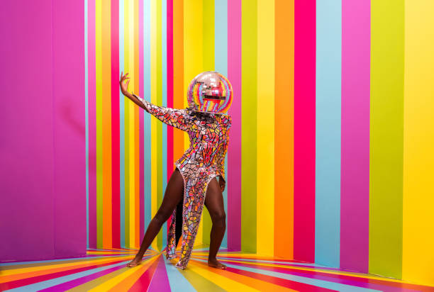 istock Beautiful young woman dancing and having fun inside a rainbow box room 1356920177