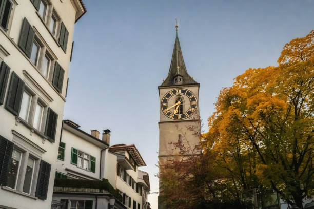 low angle view on St. Peter Church in Zurich in old town at autumn blue hour