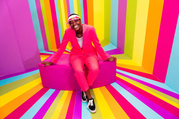 istock Beautiful young woman dancing and having fun inside a rainbow box room 1356922226