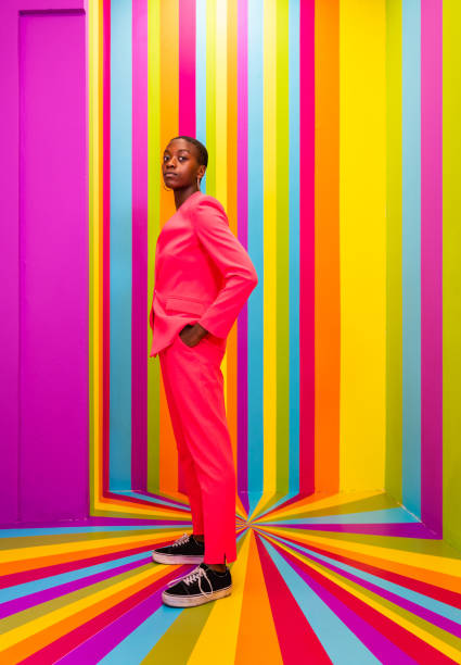 istock Beautiful young woman dancing and having fun inside a rainbow box room 1356923483