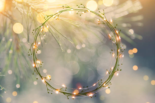 Pine tree background for Christmas Decoration with light garland and copy space for your text