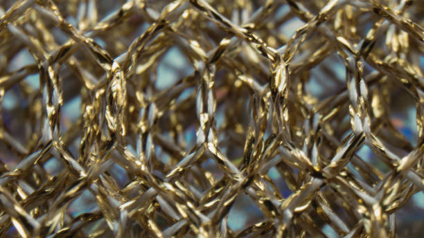 istock background of golden mesh fabric close-up 1356924265