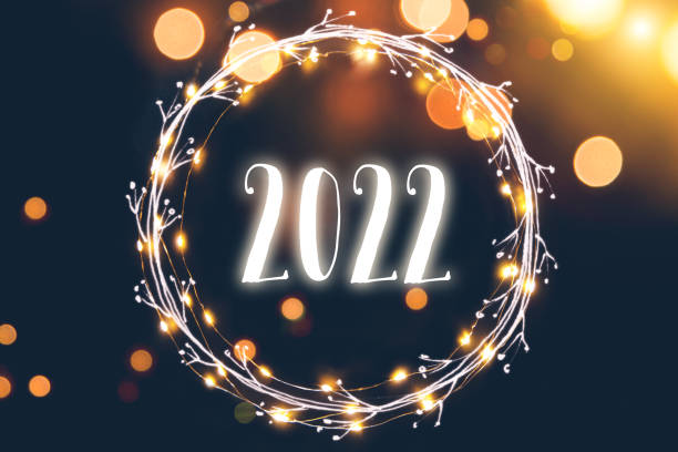 istock Defocused light background with circular light garland and New year 2022 1356924884