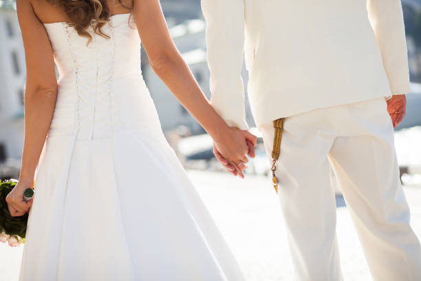 istock Bride and groom walking together holding their hands 1356924923