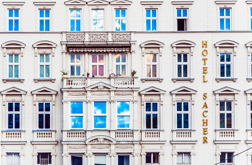 Apartments facade balconies in a row from below