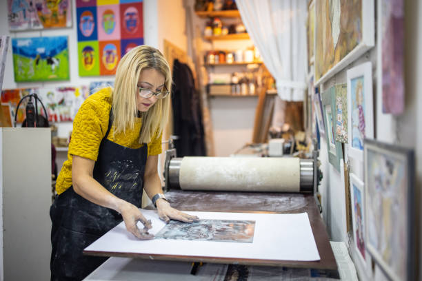 istock Female craft person, preparing engraved imprint 1356928856