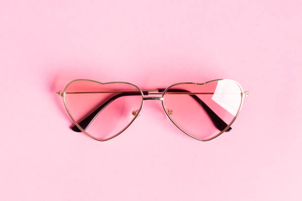 istock Heart shape sunglasses on pink 1356929792