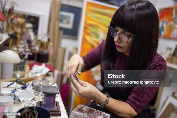 https://media.istockphoto.com/id/1356929850/photo/dedicated-and-skilled-female-jeweller-making-a-ring-in-her-workshop.jpg?s=612x612&w=is&k=20&c=f92SynrAlsnmAth1KW9u9qhYq8vFjgQCI7FlHLOqVXM=