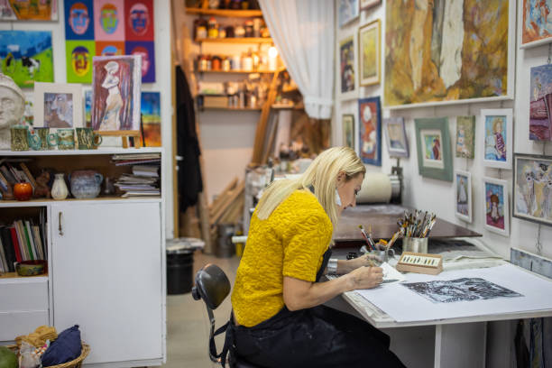 istock Dedicated and creative female artist, making art in her art studio 1356930671
