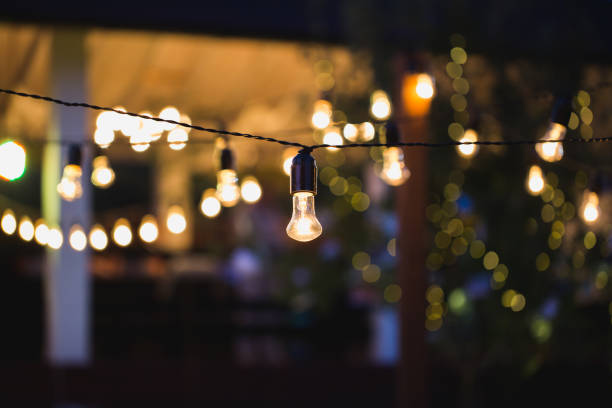 istock Light bulb decor in outdoor party 1356934194