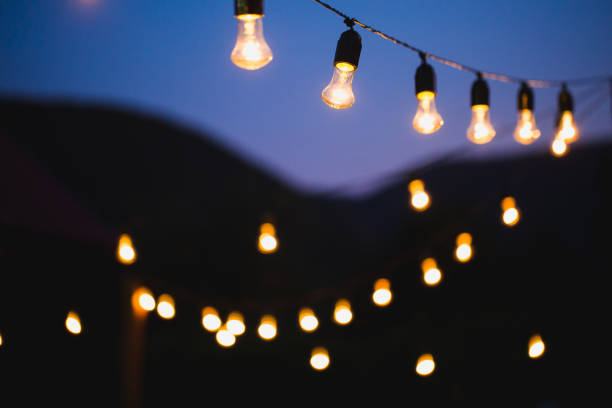 istock Light bulb decor in outdoor party 1356934198