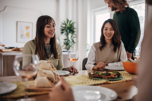 istock Group of friends on dinner party 1356934656