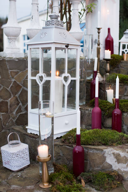 istock wedding decor with flowers and bottle candles 1356934787