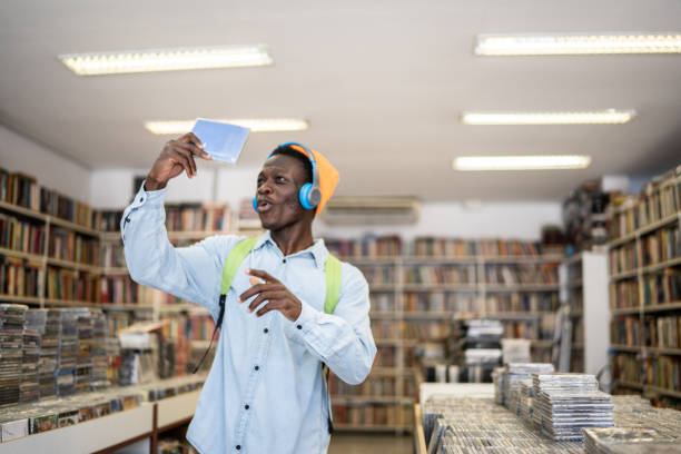 istock Young man browsing in a music store 1356940592