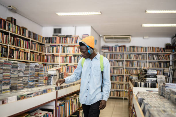istock Young man browsing in a music store 1356940599
