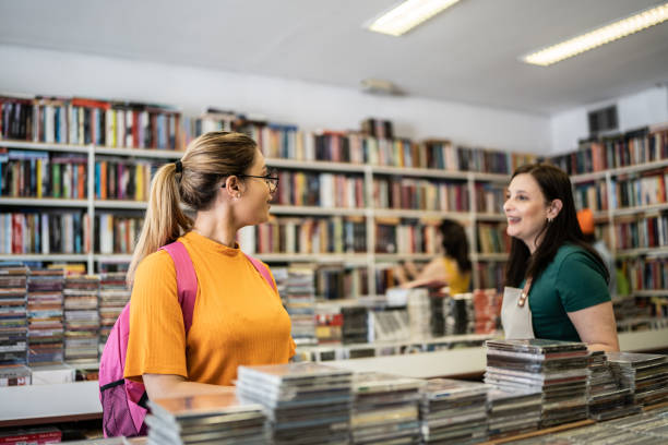 istock Saleswoman helping customer in a thrift store 1356940650