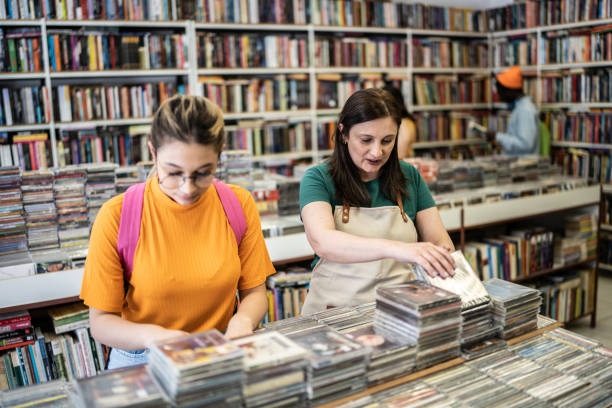 istock Saleswoman helping customer in a thrift store 1356940651
