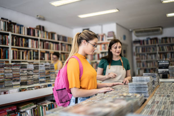 istock Saleswoman helping customer in a thrift store 1356940664