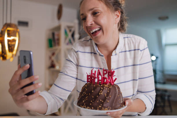 istock Wishing a birthday wish and communication on a video call 1356944265