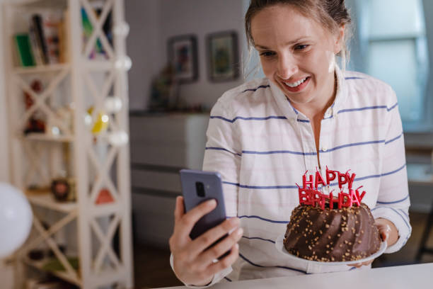 istock Wishing a birthday wish and communication on a video call 1356944441