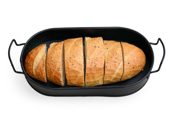 istock sliced sesame bread in a black bread basket with isolated white background 1356946243