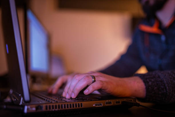 istock Unrecognizable Caucasian trader observing the stock market data on his computer 1356949780
