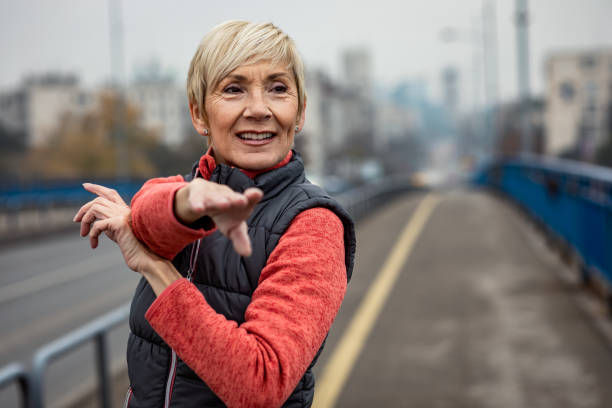 istock Active senior woman stretches her muscles before running. 1356953204
