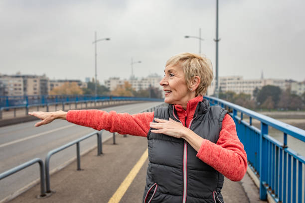 istock Active senior woman stretches her muscles before running. 1356953273