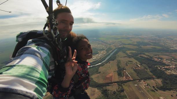 istock Beautiful black woman practicing skydiving. 1356954355