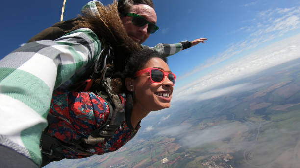 istock Beautiful black woman practicing skydiving. 1356954369