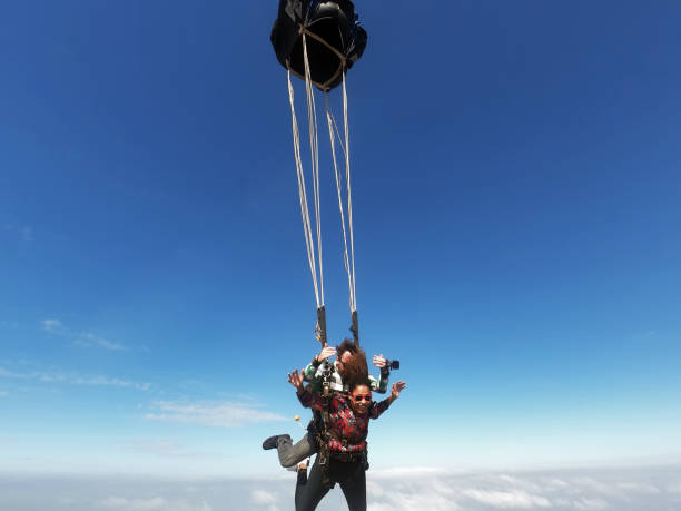 istock Beautiful black woman practicing skydiving. 1356954636