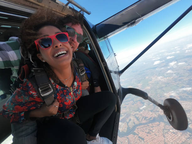 istock Beautiful black woman practicing skydiving. 1356954649