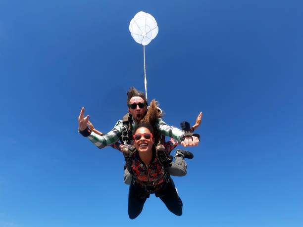 istock Beautiful black woman practicing skydiving. 1356954666